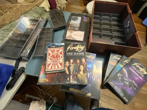 Repacking the original games and expansions into the crate | Firefly ...