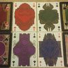 Card comparison.  Old cards on outside, 2nd edition cards on the inside.