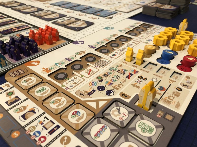 A few of the custom wooden pieces for our prototype printed by Meeple Studio (not final art).