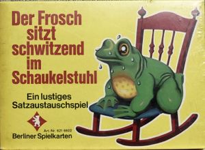 Der Frosch sitzt schwitzend im Schaukelstuhl