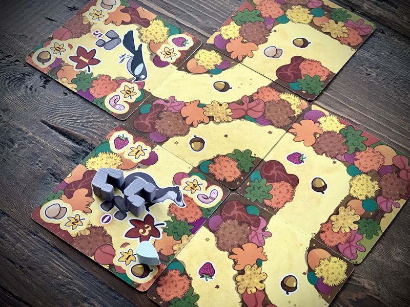 Detailed view of a random turn. Players build tracks to help animals get their favorite food.