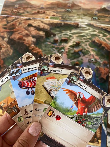 A couple of cards and a board ready for Gen Con (prototype image)