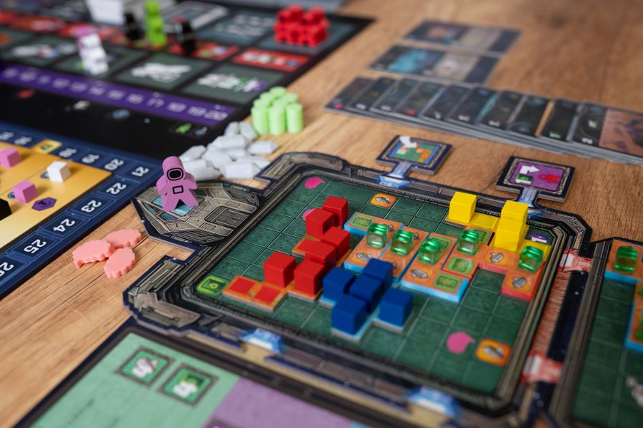 Collision Point game components including meeples, tokens, and mission tiles