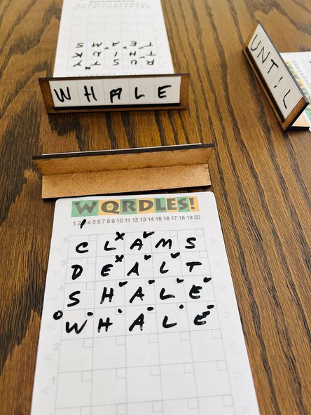 WQRDLES: A Tactile Wordle-Like Multi-Player Word Deduction Game doboz