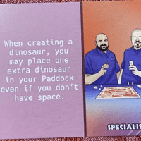 Dinosaur Island:  Dice Tower – Sam and Zee Promo Card