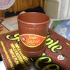 Vintage Triple Yahtzee Cup and Logo, atop the textile-look box