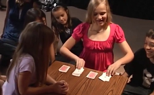 girl performing card tricks