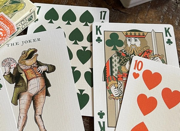 gambling frog playing cards