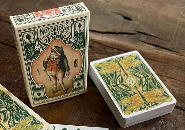 gambling frog playing cards