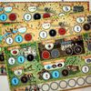 New (2nd?) printing includes English player-boards. central board and additional buildings not translated.