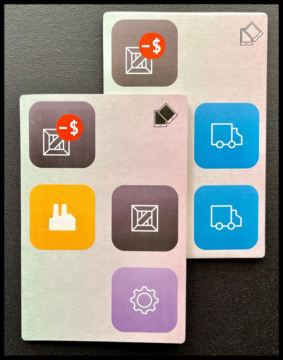 two cardboard rectangles featuring a 2x6 grid of icons overlap at one corner