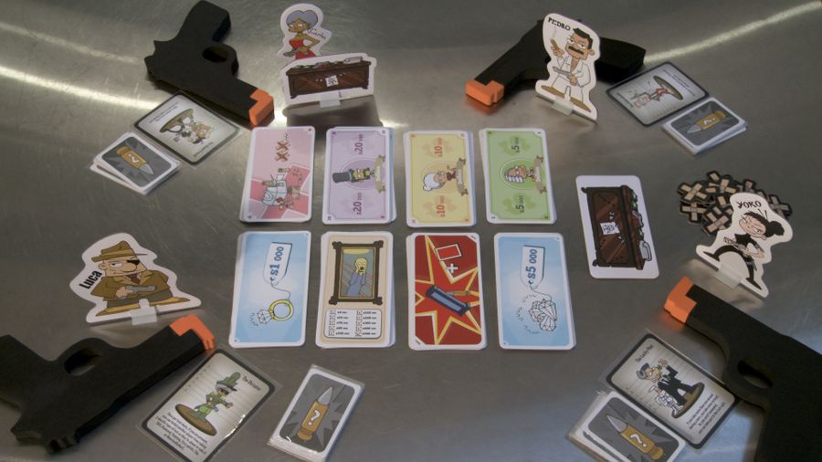 Image of the components to Ca$h 'n Guns including cards, guns, and character standees