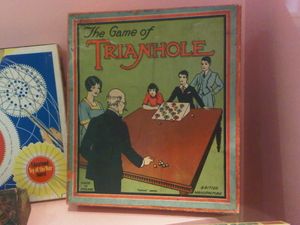 The Game of Trianhole