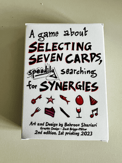 A game about selecting seven cards, speedily searching for synergies.