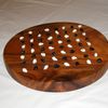 Ohia wood board carved by Bernard Gomes with cowrie shells as pieces