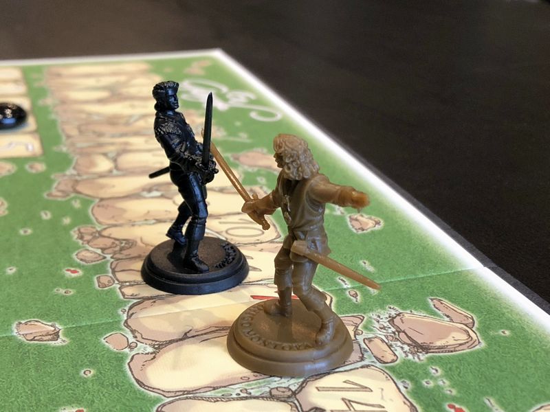 Finally, playing En Garde the way it was meant to be played—with figures from The Princess Bride Adventure Book Game.