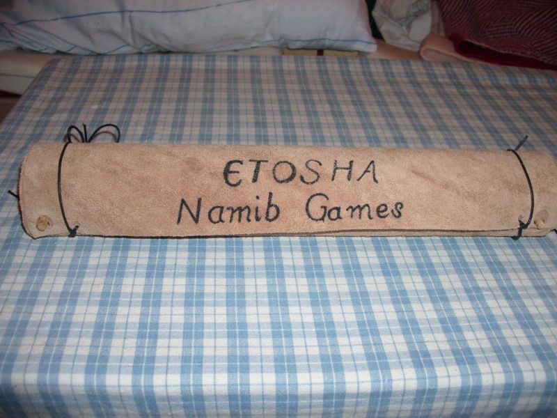 Leather tube, which, unfolded, also serves as game board