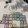 End of a two-player game. Only areas of x cards number x count (like 4 cards 4 or 2 cards 2), otherwise negative. Areas of 5+ cards of the same colour count for 1 of each card. Butterflies count for 1 if next to the right colour. This is worth 21 points.