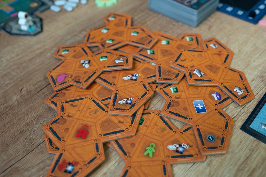 Collision Point player boards shaped like spaceships with resource slots